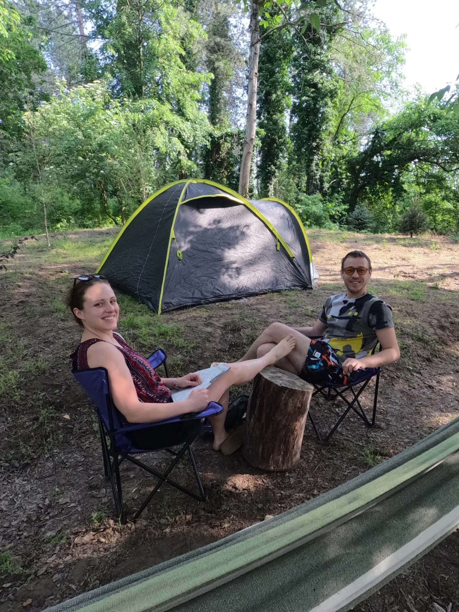 Tent campers relaxing at Šumski Mir Co-Working Camp in Deliblato Sands forest, Serbia